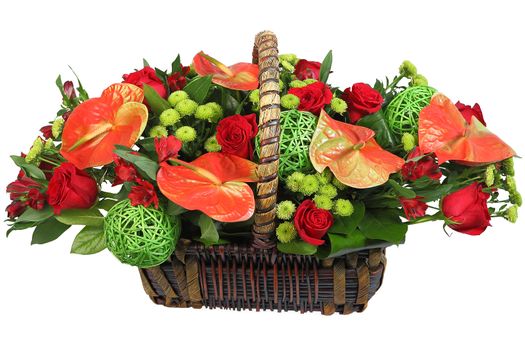A bouquet of flowers in a wicker basket, red anthurium, spray chrysanthemum, red rose. Floristic composition, flower arrangement, Isolated image on white background.