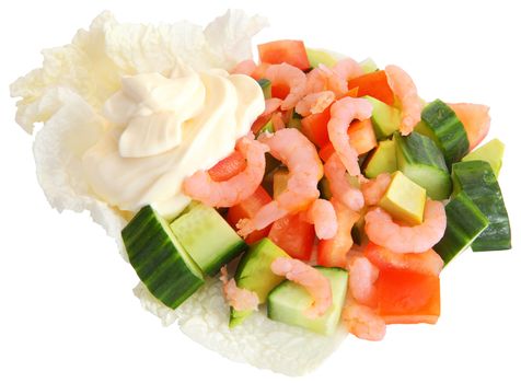 On lettuce leaves are sliced green cucumber, red pepper, shrimp and butter, isolated image on a white background, horizontal arrangement, no body.