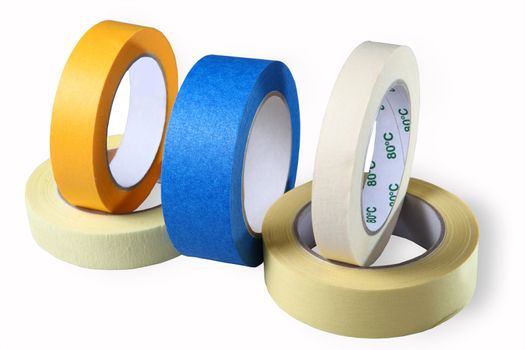 Adhesive tape on paper, blue, yellow and brown, horizontal, image, isolated, on a white background.