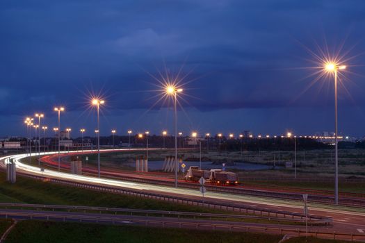 ST-PETERSBURG, RUSSIA - SEPTEMBER 17: Ringway St Petersburg, September 17, 2009. Mast lighting on the night road. Electric lighting on night the highway. Russian highways.