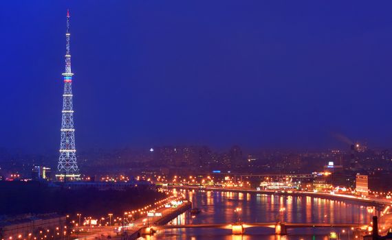 ST-PETERSBURG, RUSSIA - JANUARY 18: View from the top of the city at night, the television tower enabled illumination, and the river Neva, January 18, 2012. TV Tower with night illumination.