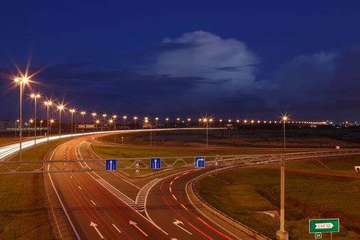 ST-PETERSBURG, RUSSIA - SEPTEMBER 17: Ringway St Petersburg, September 17, 2009. The mast lighting on the night road. Electric lights in the night highway. Road lighting lanterns. Russian roads.