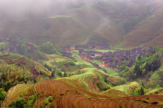 GUANGXI PROVINCE, CHINA - APRIL 3: Dazhai Yao village, near Longsheng, Guangxi province, southwest China. April 3, 2010. Terraced rice fields on a hillside, Jinkeng Terraced Field, Guangxi Province, China.