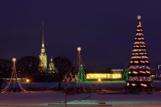 ST-PETERSBURG, RUSSIA - JANUARY 3: Christmas decorations of the Russian city, Russian Federation, Saint Petersburg, January 3, 2009.  Christmas tree on the spit of Vasilievsky Island. Urban photography in the evening light.   The Russian Federation, Saint Petersburg, New Year's Eve street design with night lighting.