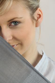 Shy girl behind scarf