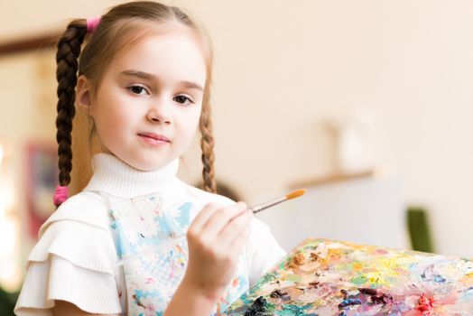 portrait of a girl standing next to his easel, a drawing lesson