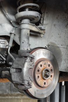 Car disc brake inspection in garage for safety use