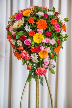 Flower bouquet isolated on white curtain in party room