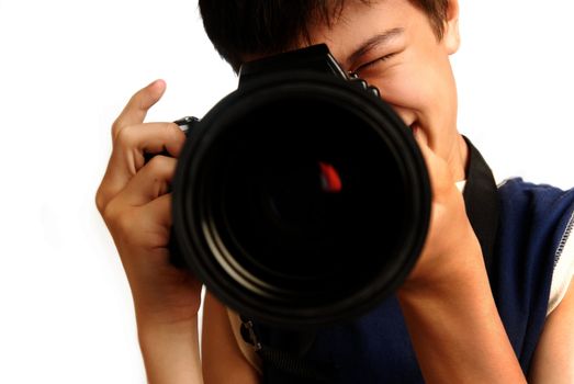 Boy with digital photo-camera making a shot