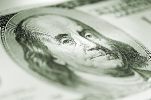 Portrait of Benjamin Franklin beholder bills through clerical gum