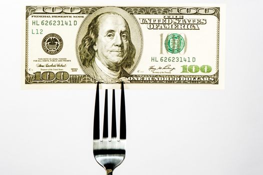 Hundred dollar bill on a fork