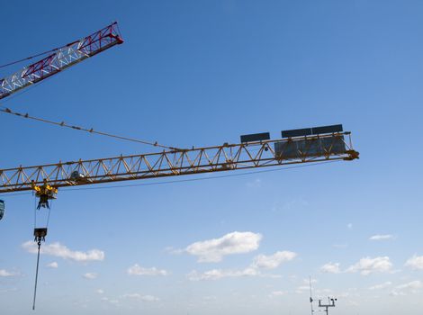 construction crane and a weather station with a blue sky