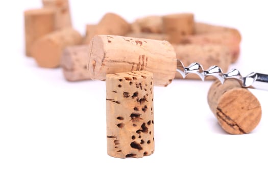 Corkscrew and wine corks close-up on the white background