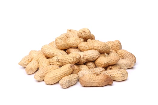 Dried peanuts in closeup on the white background
