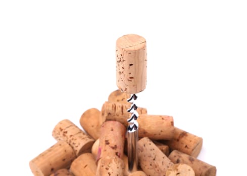 Corkscrew and wine corks close-up on the white background