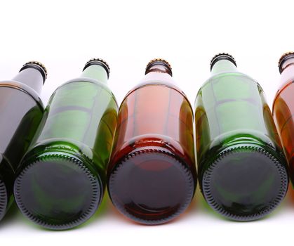 bottles lying in row. The bottoms of bottles close-up.