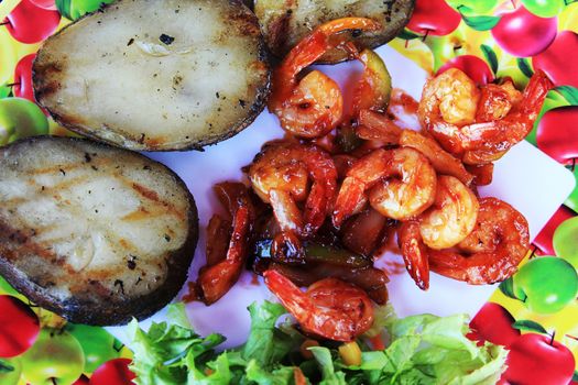 prawn in sweet red sauce with a potato and vegetables