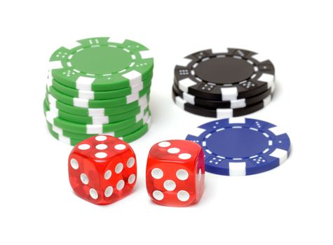 Poker chips and dices on white