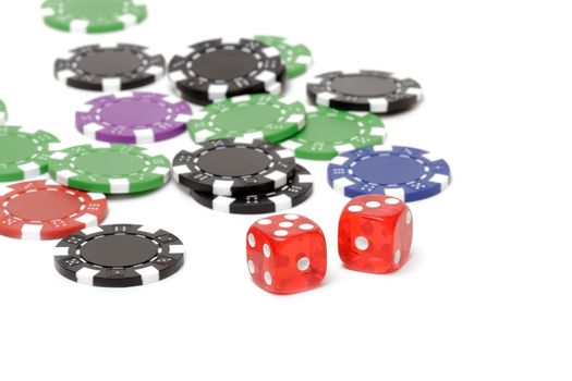 Poker chips and dices on white