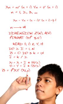 Photo of the young boy solving the mathematical problem
