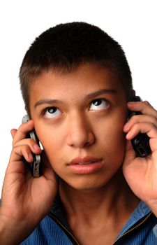 Boy with two cell phones on a white background