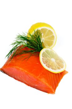 Arrangement of Delicious Smoked Salmon, Dill and Lemon isolated on white background
