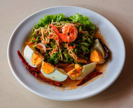 Winged bean spicy salad with boiled egg and cooked shrimp