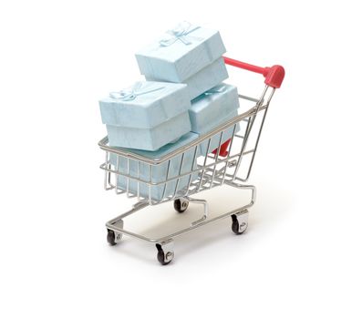 Shopping cart with cyan gift boxes on white