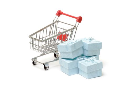 Shopping cart with cyan gift boxes on white