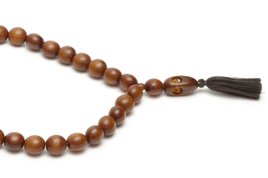 Wooden rosary on white background