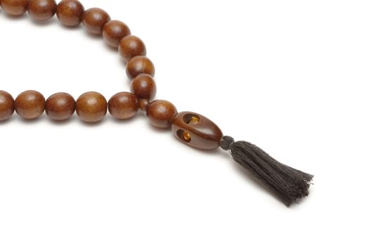 Wooden rosary on white background