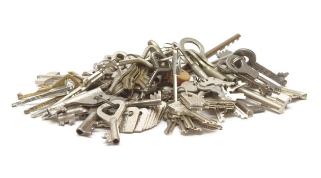 Heap of keys on white