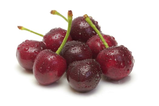 Ripe cherries on white background