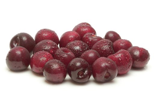 Ripe cherries on white background