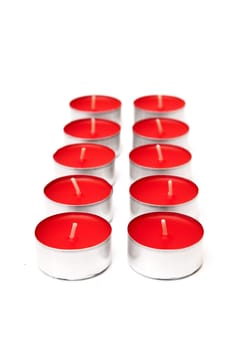 red colored candles on a white background