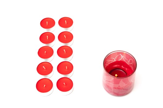 red colored candles on a white background