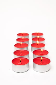 red colored candles on a white background