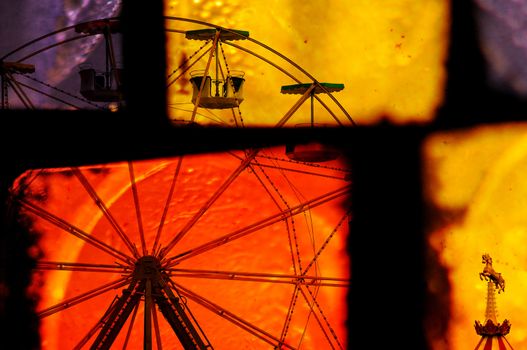 Ferris wheel and carousel horse with grungy colorful shapes. Expired fim effect.