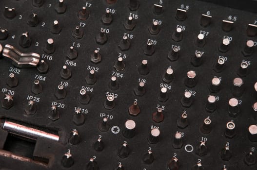 Several screws neatly stored in your briefcase