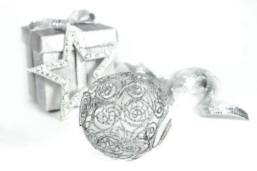 Silver christmas gift with decoration isolated on white background