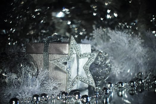 Silver christmas gift and different shiny decoration