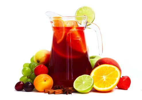 Refreshing fruit sangria in jug with different fruits solated on white