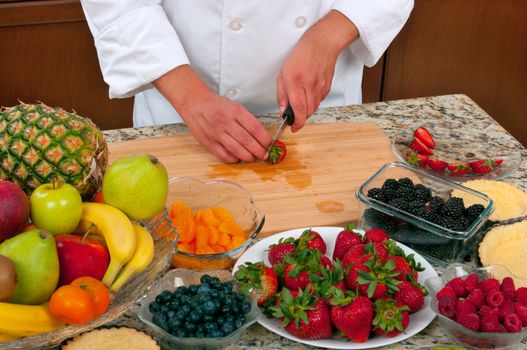 Chef making fruit tarts