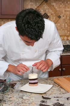 Chef making mousse cake and decorating