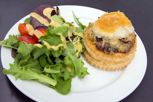 Chicken Pot Pie with Leafy Green Vegetables Tomatoes and Salad Dressing