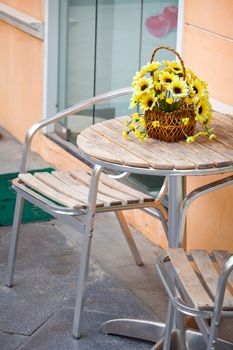 Classic exterior with chair and yellow flower