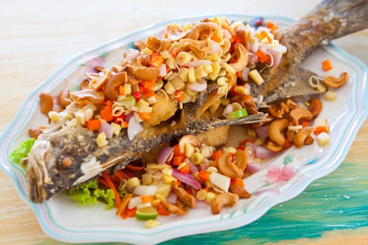 Fish food arranged on a white plate