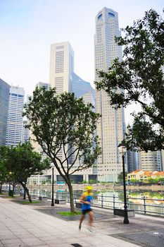 Unidentified men running on Singapore quayside in the morning