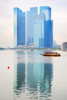 Modern office building reflected in Singapore river