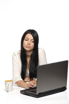 Stressful business woman working on laptop 